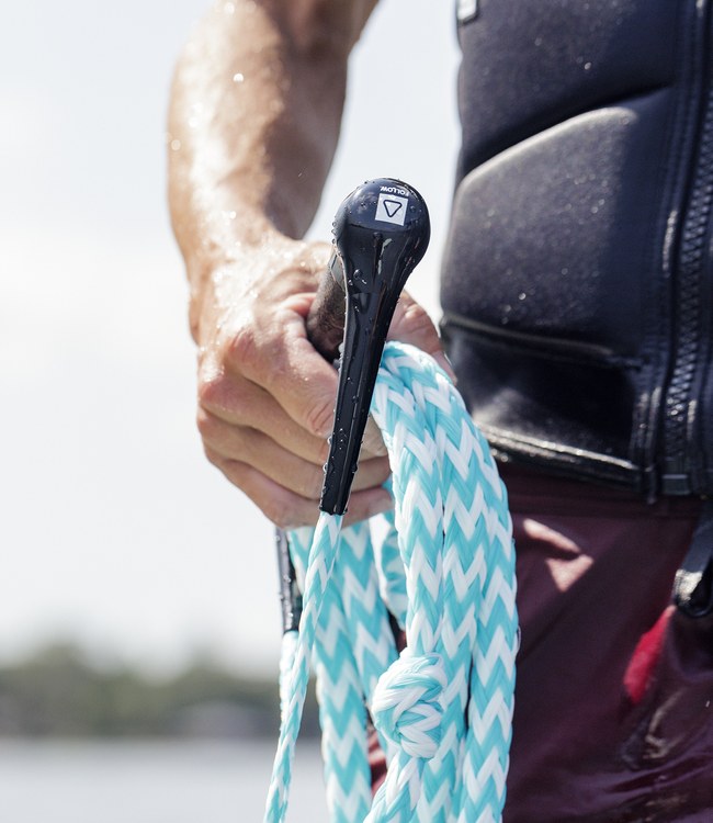 Follow Surf Package Teal wakesurf rope and handle in use behind the boat on the wave