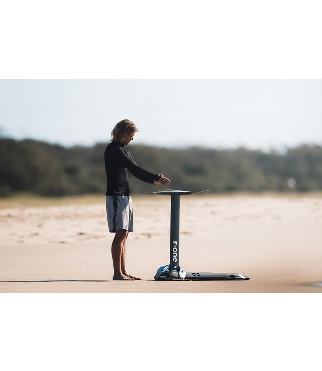 Follow P1 Mens 1mm Heater Top Black worn on the water for warmth between wakeboard sets