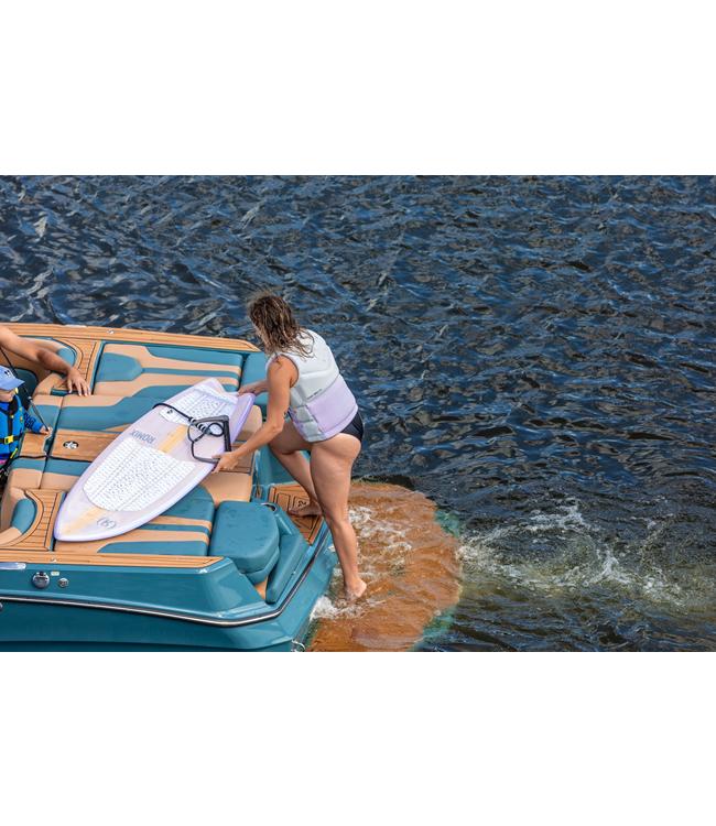 Ronix Womens Koal Classic Fish Wakesurfer - rider climbing back onto the boat with the board