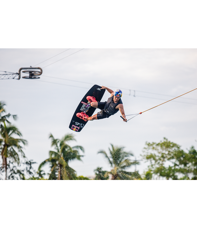 Jetpilot Raph X1 Black Mens Life Vest worn by rider on dock showing trim wakeboard fit