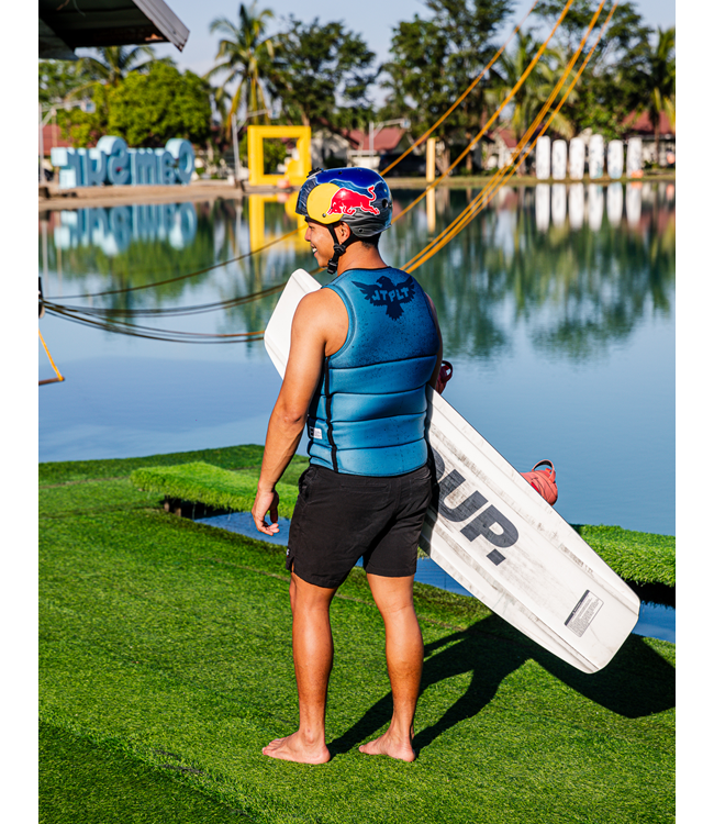 Jetpilot Raph X1 Deep Teal Mens Life Vest rider portrait near boat showing vest cut