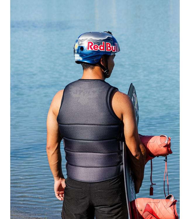 Jetpilot Raph X1 Black Mens Life Vest rider portrait near boat showing vest profile