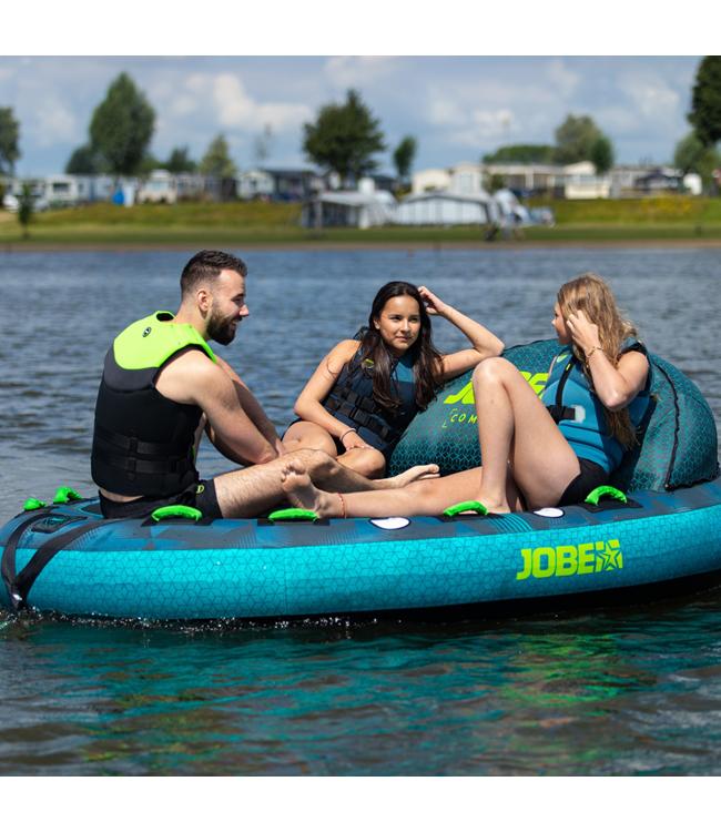 Jobe Compound 3-person ski tube - action shot of three riders leaning into a turn