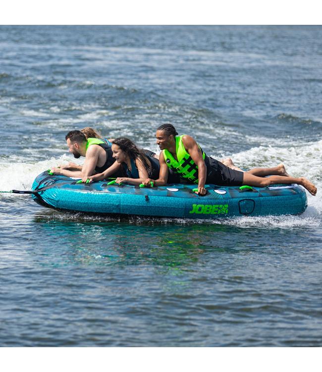 Jobe Compound 4-person ski tube - action shot of four riders on the tube behind a boat