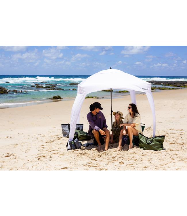 Jetpilot Grey Cabana in-use lifestyle shot on a beach with riders sheltering from sun