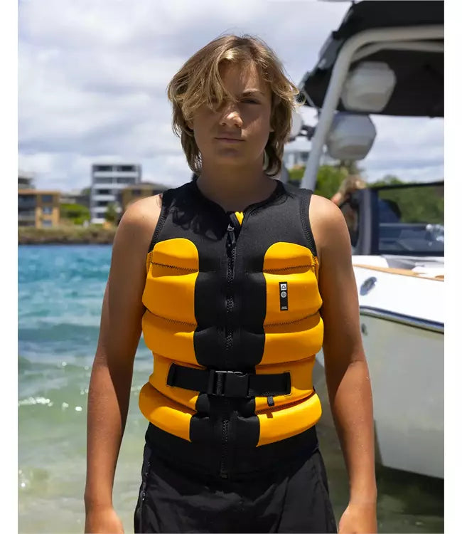 Follow Global Youth Orange Life Vest worn by a young rider behind the boat on open water