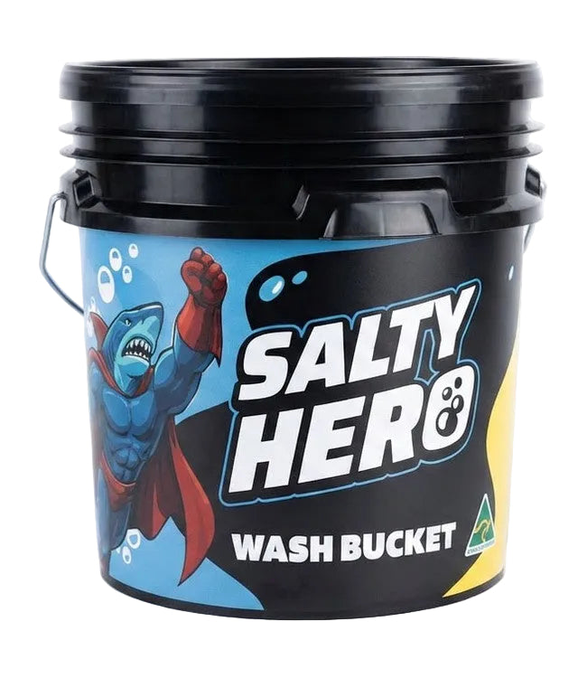 A black plastic wash bucket with a handle and a colorful label reading 'SALTY HERO WASH BUCKET,' featuring a blue shark superhero illustration on a white background.