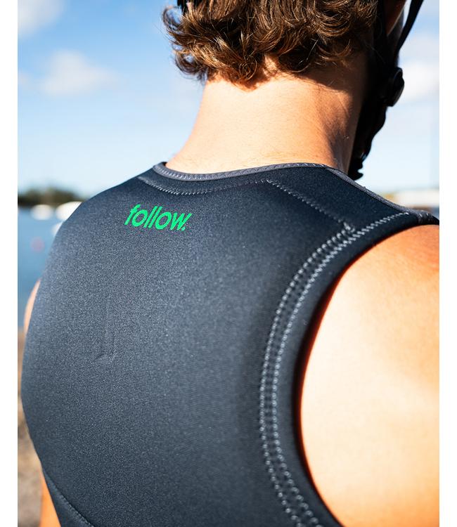 Follow Corp Black/Green Mens Life Vest worn during a deep-water start behind the boat
