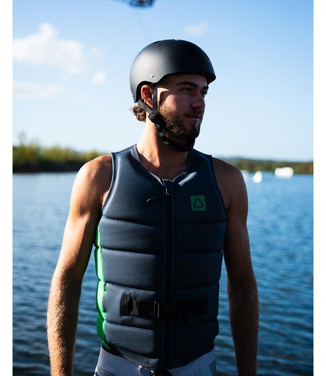 Follow Corp Black/Green Mens Life Vest on a wakeboarder riding the wake at speed
