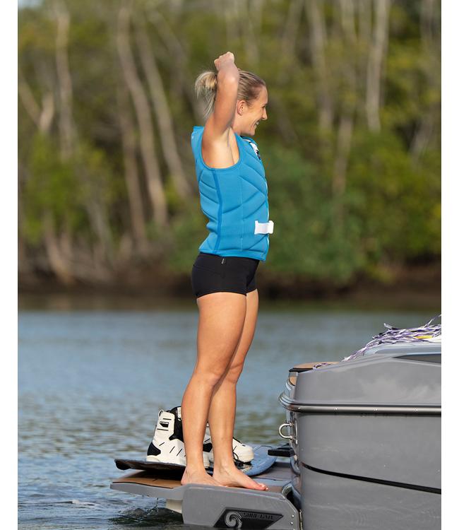 Follow Atlantis Blue Womens Life Vest worn by a woman wakeboarding behind the boat