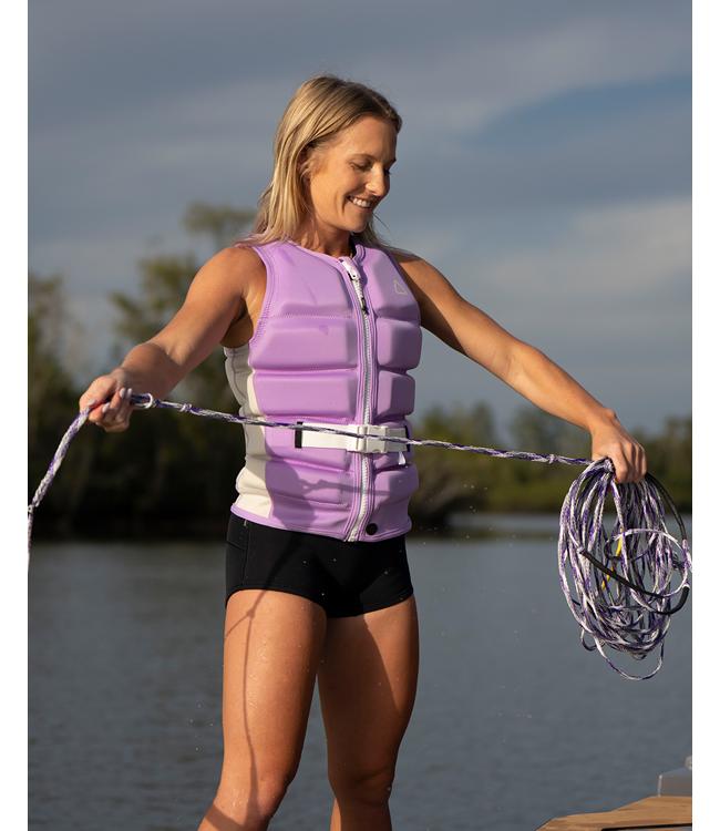 Follow Corp Purple Womens Life Vest on a rider carving across the wake on open water