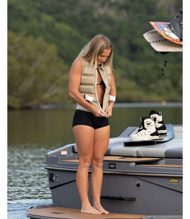 Follow Corp Sand Womens Life Vest worn by a woman riding behind the boat on open water
