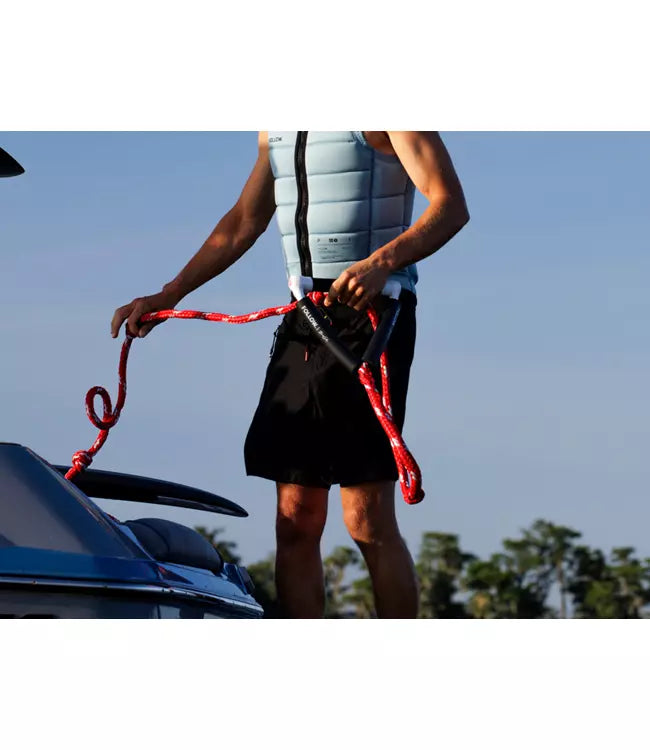 Follow Tow-In Surf Package - lifestyle shot of tow-in setup with rider behind PWC using denim grip handle
