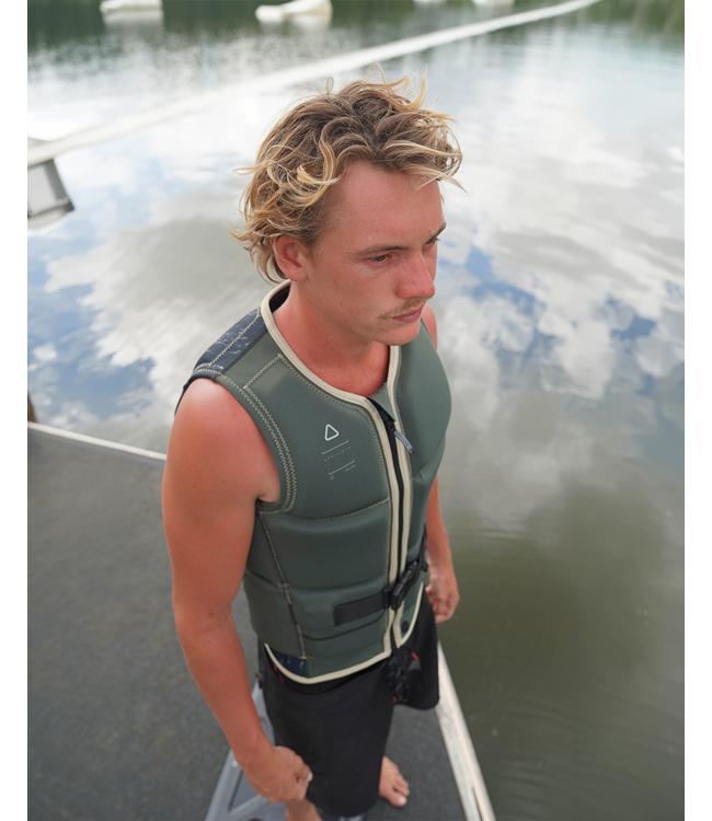 Follow Affiliate Olive Mens Life Vest worn by a wakeboarder carving across the wake behind the boat