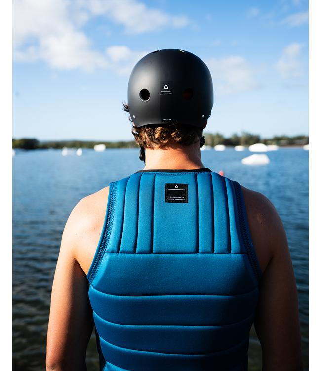 Follow Total Blue Mens Life Vest worn during a deep-water start behind the boat on open water