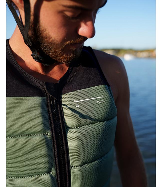 Follow Section Black/Petina Mens Life Vest worn by a wakeboarder riding behind the boat