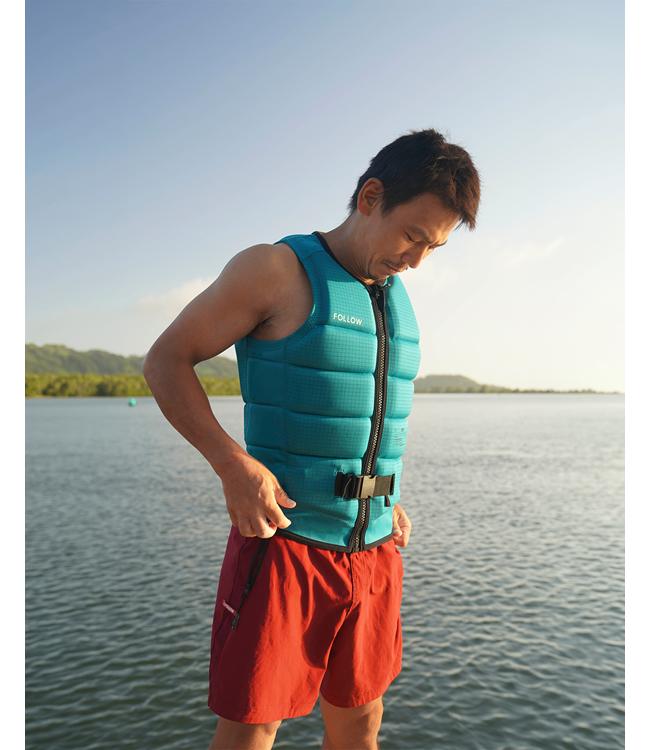 Follow P1 Traction Emerald Mens Life Vest on a rider carving across the wake on open water