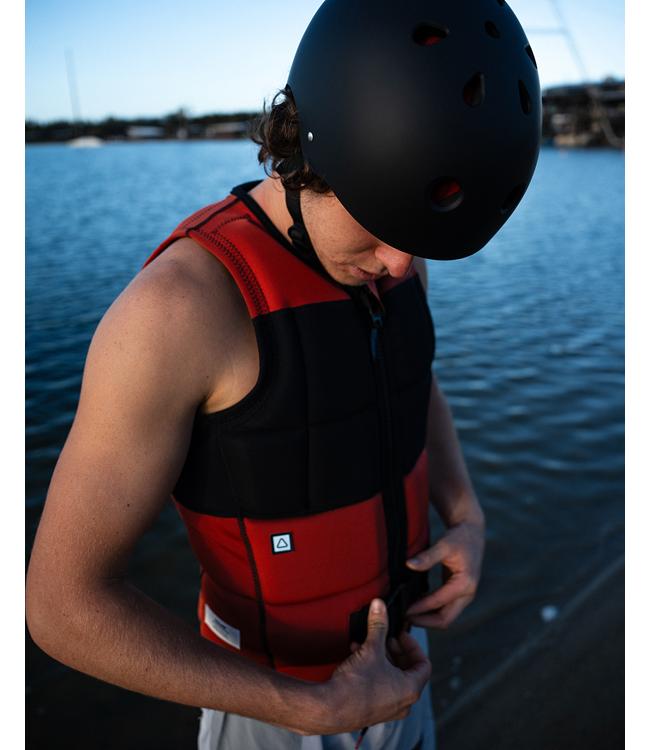 Follow Gratis Rust Mens Life Vest on a wakeboarder riding the wake at speed on open water