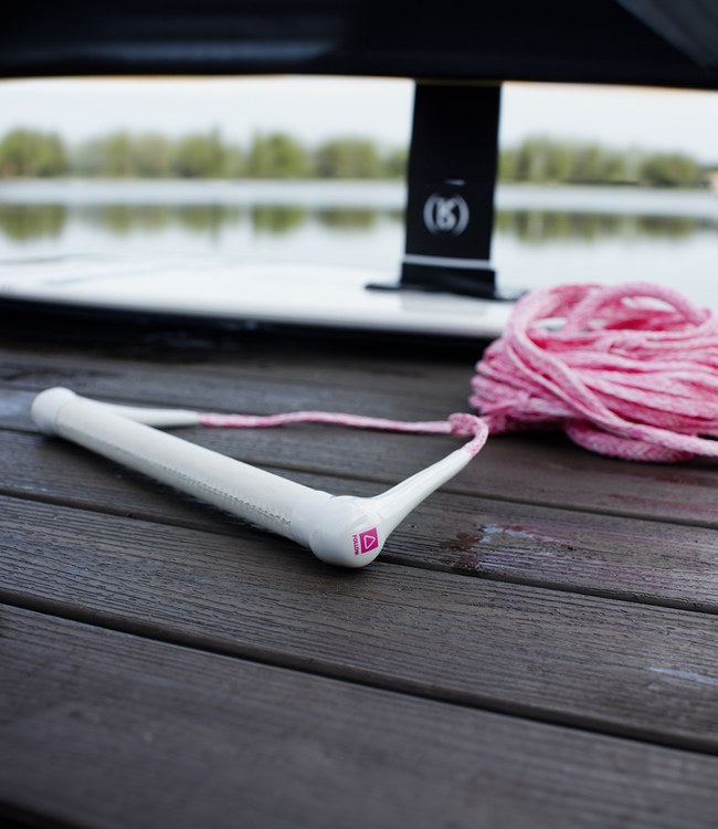 Follow Basic Pink Wake Rope and Handle held by a rider getting set behind the boat