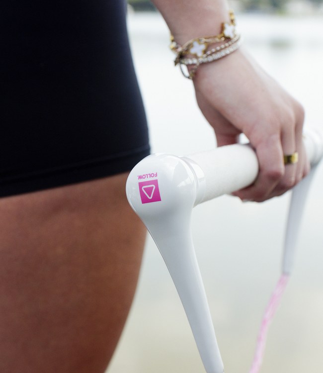 Follow Basic Pink Wake Rope and Handle in use during a wakeboarding session on open water