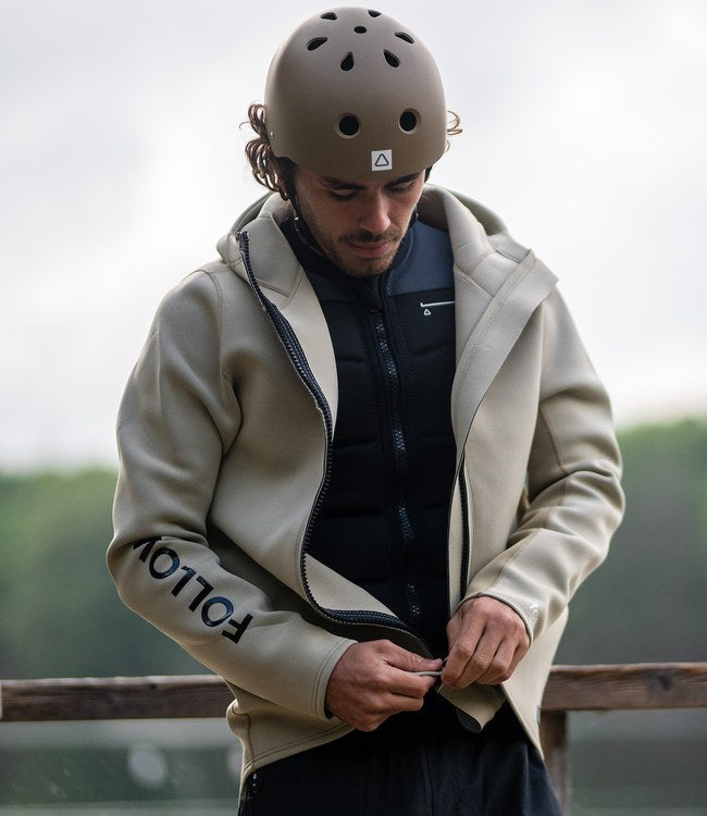 Follow Company Neo Jacket Khaki worn by a rider during an early session behind the boat