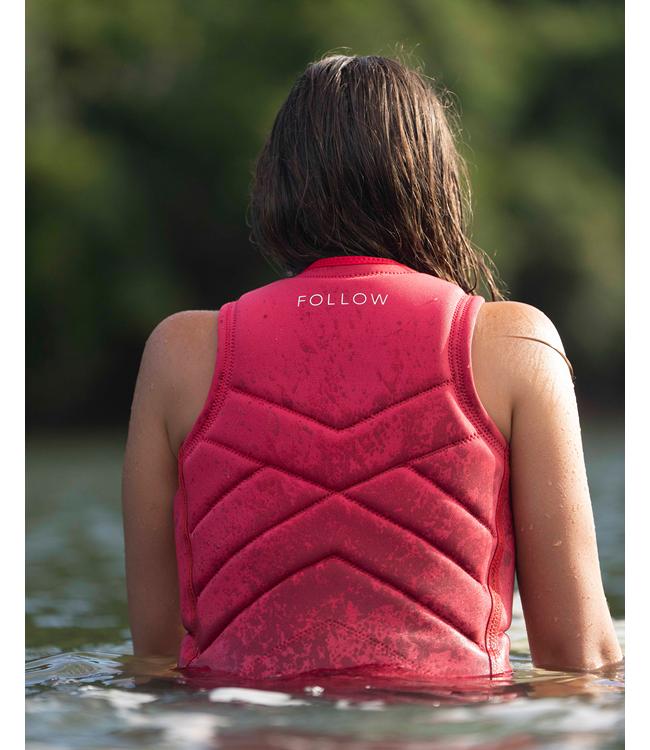 Follow Atlantis Azalea Womens Life Vest worn by a woman on the water during a wakeboard session