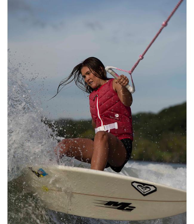 Follow Atlantis Azalea Womens Life Vest worn by a woman riding behind the boat on open water