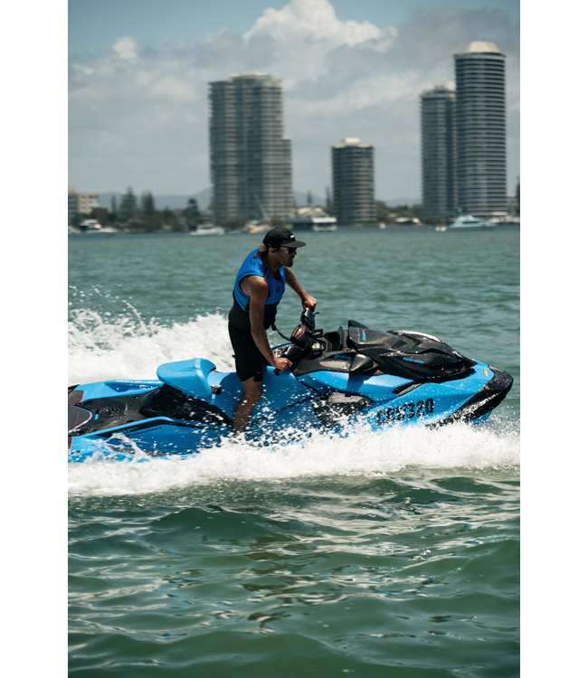 Jetpilot Vault Hyperflex Blue Mens Life Vest worn lifestyle alternate angle near boat