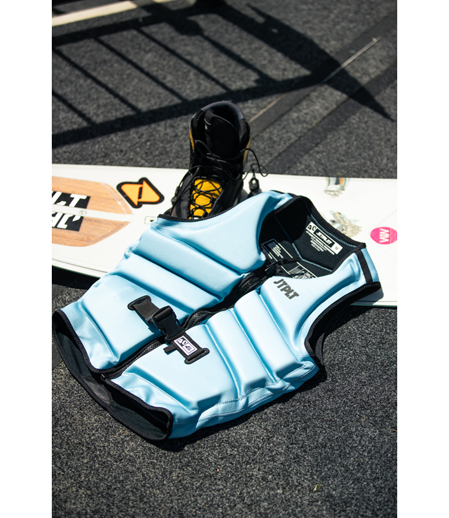 Jetpilot Freeride Steel Blue Mens Life Vest worn alternate lifestyle angle on dock at sunset