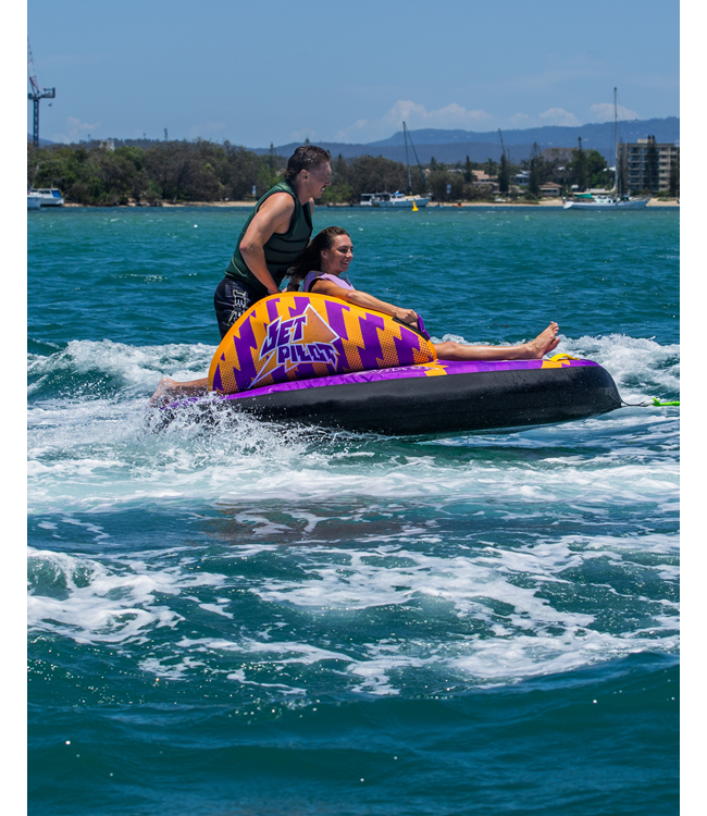 Jetpilot Chaser Single Rider Ski Tube lifestyle shot showing rider being towed on water