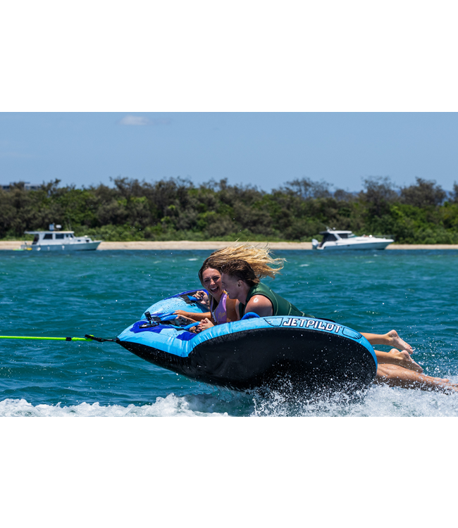 Jetpilot Hyper Wing 3 Person Ski Tube lifestyle shot of riders mid-tow behind boat