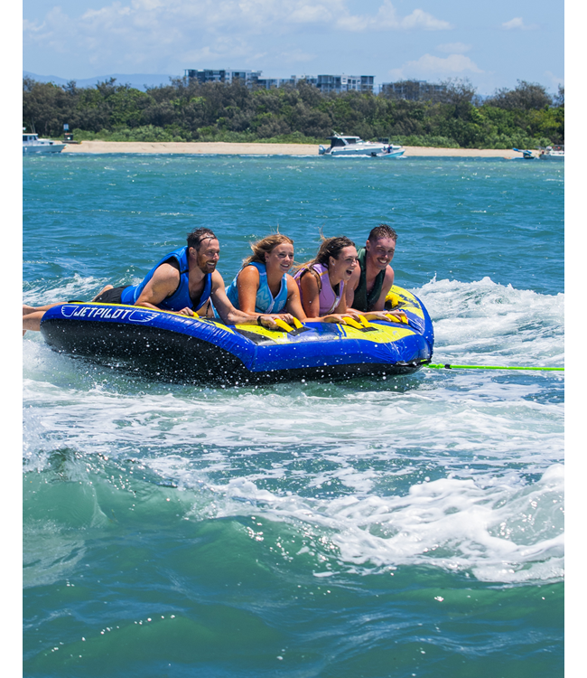 Jetpilot Hyper Wing 4 Person Ski Tube lifestyle shot of riders mid-tow behind boat