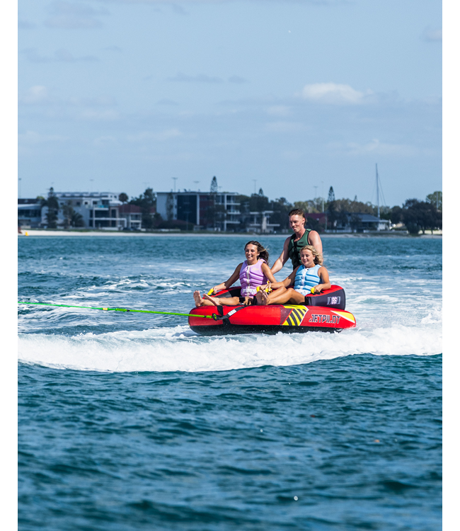 Jetpilot Freeride 3 Person Ski Tube riders showing sit-down tow position with handles