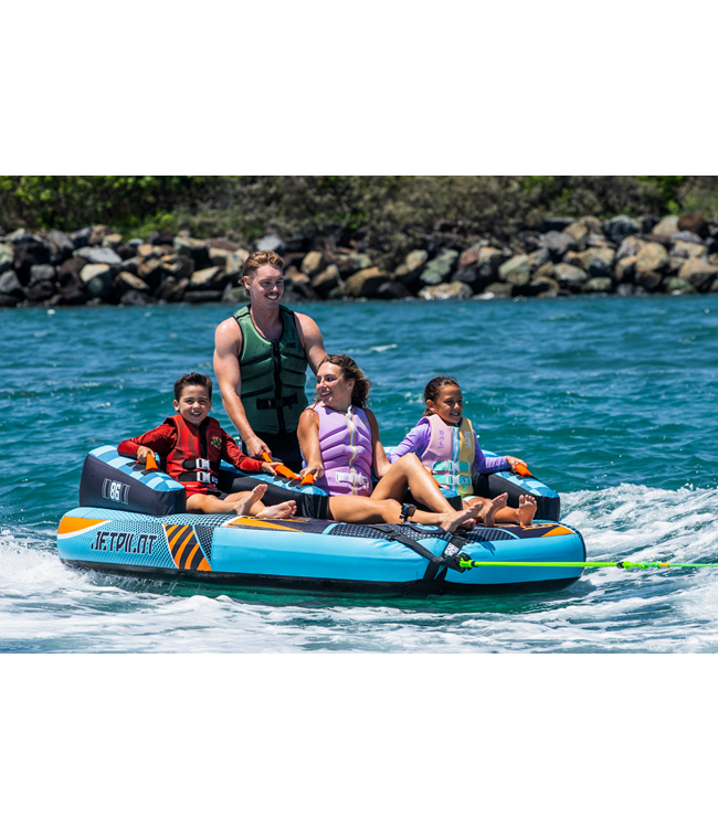 Jetpilot Freeride 4 Person Ski Tube lifestyle shot of riders mid-tow behind boat