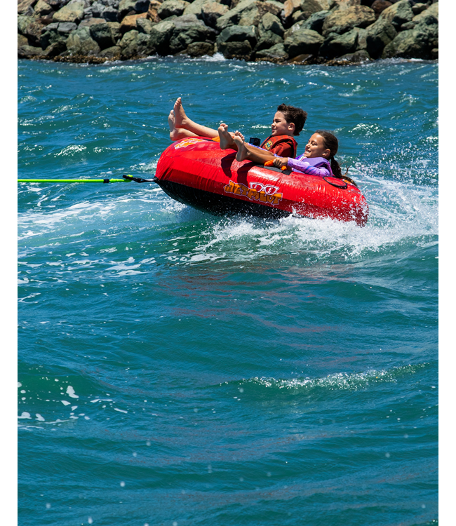 Jetpilot Whizzer 2 Person Ski Tube lifestyle shot of riders mid-tow behind boat on lake