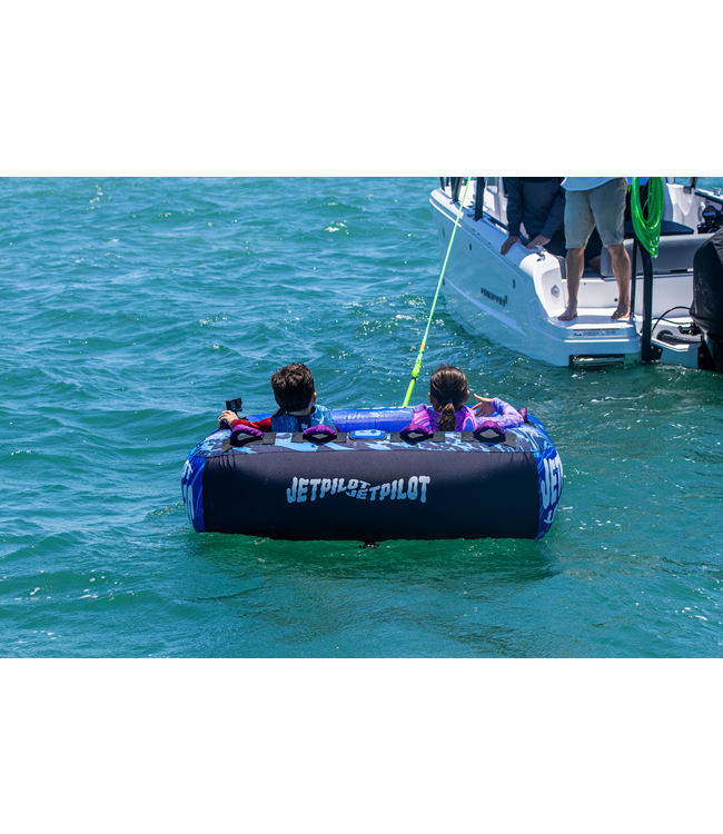 Jetpilot Skater Ski Tube on-water action shot showing rider standing on the tube at speed