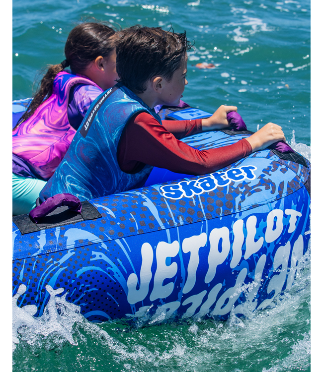 Jetpilot Skater Ski Tube alternate angle showing rider mid-stand on the tube at speed