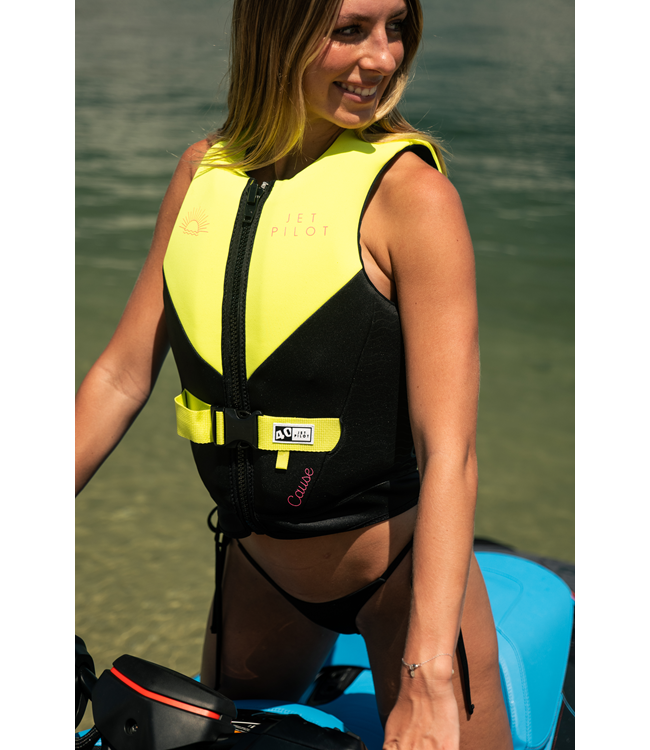 Jetpilot Cause Yellow Womens Life Vest worn lifestyle shot of female rider near boat dock