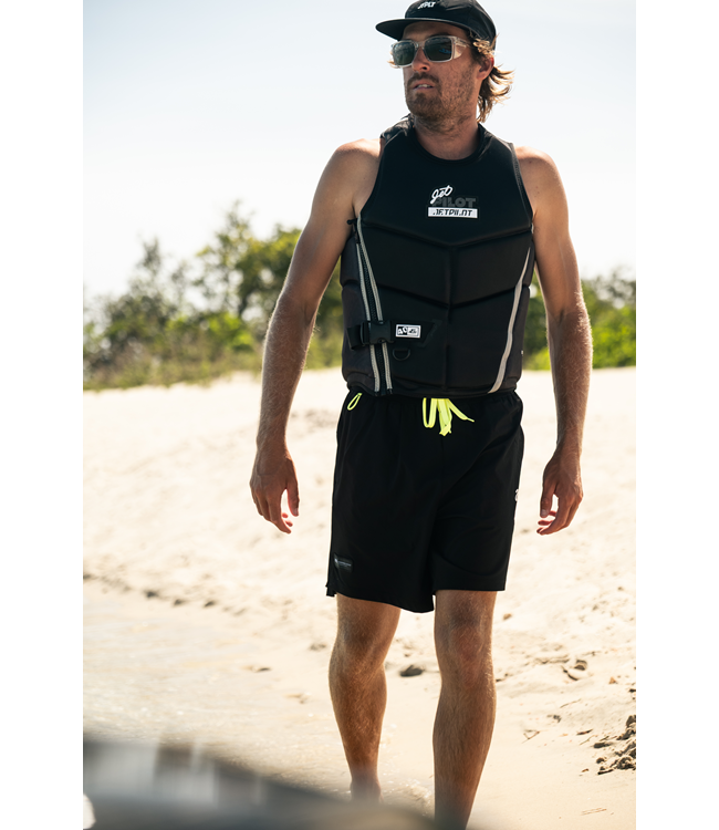 Jetpilot Nighthawk Black Mens Life Vest worn lifestyle shot on dock showing fit profile