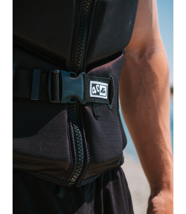 Jetpilot X Heatley Black Mens Life Vest on-water wakeboarding action with rider torso visible