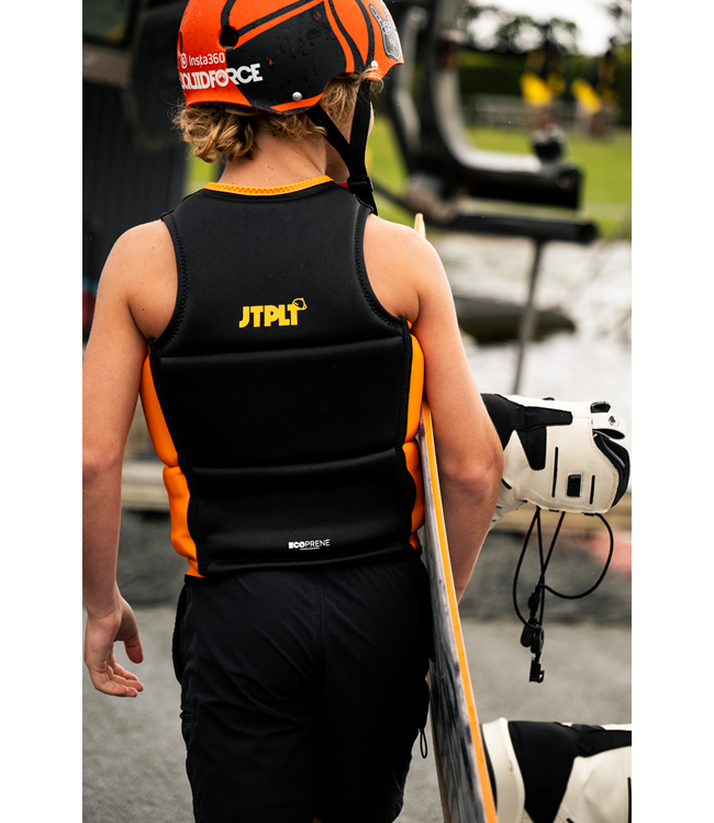 Jetpilot Freeride Black Boys Life Vest on-water action shot of boy showing panel flex