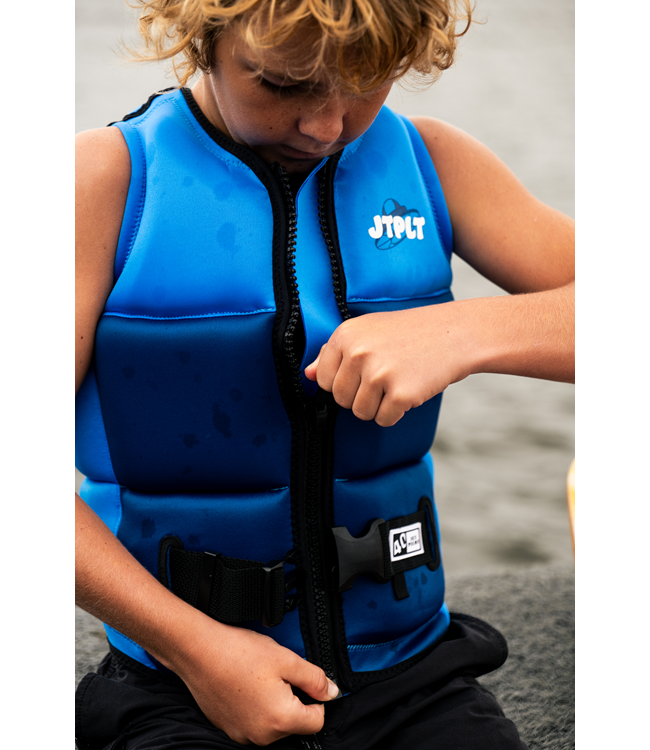 Jetpilot Freeride Blue Boys Life Vest on-water action shot of boy wakeboarding with panel flex