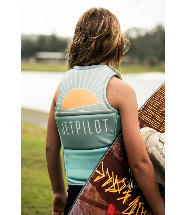 Jetpilot Freeride Teal Girls Life Vest worn lifestyle shot of young female rider near water