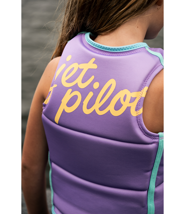 Jetpilot Freeride Purple Girls Life Vest worn lifestyle shot of young female rider on water