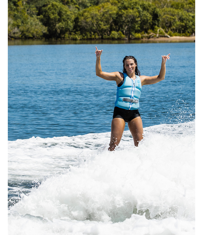 Jetpilot Allure Blue Womens Life Vest on-water wakeboard action showing torso panel flex