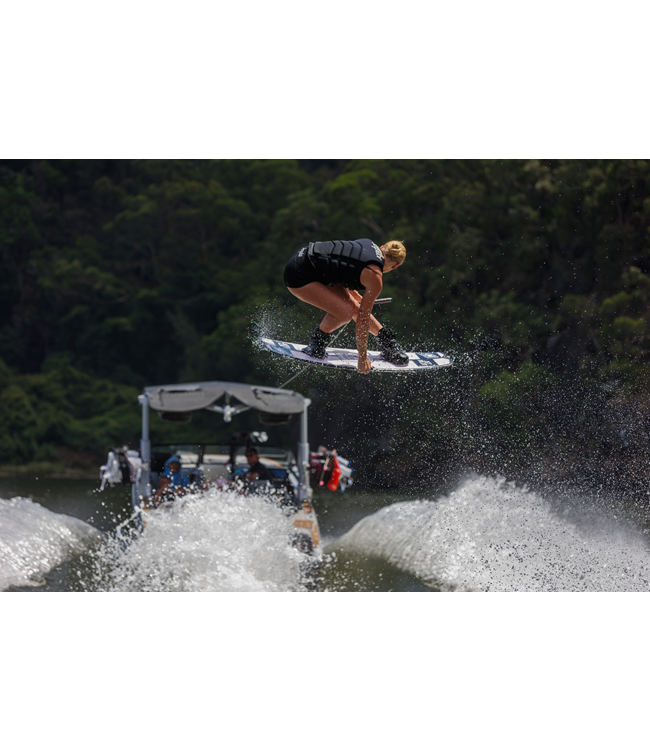Jetpilot Zahra X1 Black Womens Life Vest female rider mid wakeboard ride with full body shown