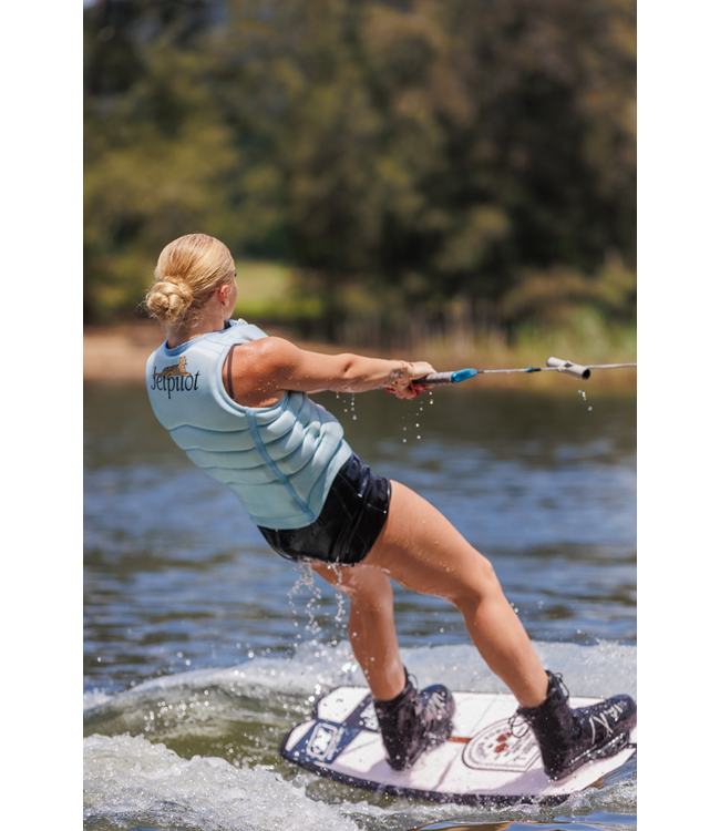 Jetpilot Zahra X1 Ice Blue Womens Life Vest worn alternate lifestyle angle at the water