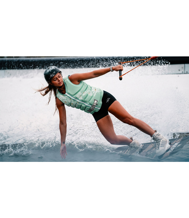 Jetpilot Isla X1 Teal Ladies Life Vest rider lifestyle close shot near boat at sunset