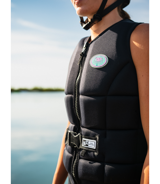 Jetpilot Aurora Black Womens Life Vest worn lifestyle shot of female rider near the water