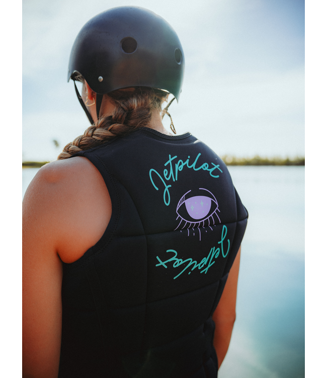 Jetpilot Aurora Black Womens Life Vest on-water wakeboard action showing panel articulation